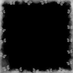 a black and white photo frame with small flowers on the edges, as well as an empty space in the middle