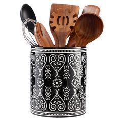 wooden utensils and spoons are in a metal can with black designs on it