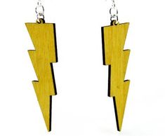 wooden earrings with lightning bolt design on the front and back of them, hanging from silver earwires