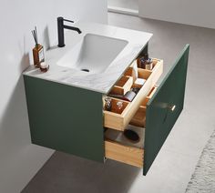 a bathroom vanity with drawers and a sink in the middle is open to reveal its contents