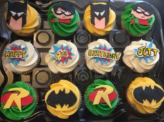 cupcakes decorated like batman and robin wayne are in a muffin tin with the words happy birthday written on them