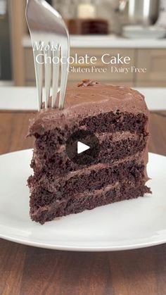 a piece of chocolate cake on a plate with a fork