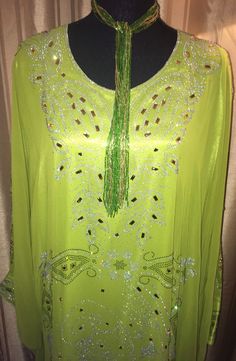 Beautiful Bling Gown.  One size fits most.  There are 2 ties inside of gown to allow for better form fit. Beautiful Chartreuse Gown Length: Between 56 to 60 inches long. Recommended Washing Instruction: - For best results dry clean or hand wash and line dry - No bleach In stock and READY TO SHIP!  Products are created in a SMOKE-FREE, PET-FREE environment. Material: 100% silk If you have any questions about the colors, size, feel free to contact me.  Please note: Due to hygiene reasons, RETURNS, REFUNDS, or EXCHANGES CANNOT BE ACCEPTED.  While I do not accept returns, if you have an issue with an item you have received, please make sure to contact me through the shop, and I'll be happy to help sort out a solution for you. Become a fan of my Facebook page: https://www.facebook.com/PreciousP Summer Wedding Floor-length Abaya, Green Full-length Maxi Dress For Party, Floor-length Green Summer Gown, Green Floor-length Summer Gown, Green Floor-length Gown For Evening, Green Chiffon Maxi Dress For Wedding, Green Long Party Abaya, Long Summer Evening Gown, Long Evening Gown For Summer