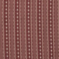 a red and white striped fabric with small dots on the bottom, in rows of lines