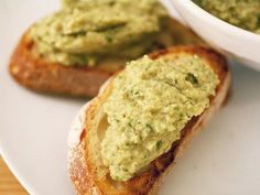 two pieces of bread with guacamole spread on them