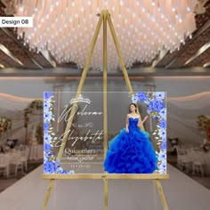 a blue dress on display in front of a chandelier