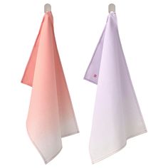 two pink and white towels hanging on clothes pins