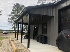 a black umbrella sitting on the side of a building