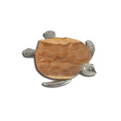 a small wooden turtle with two silver shells on it's back