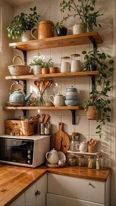 a kitchen with wooden counters and shelves filled with pots, pans, and other items