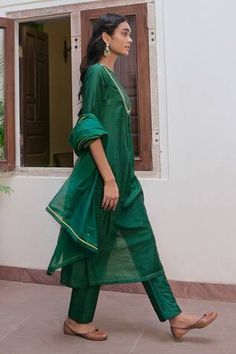 Bottle green kurta with cutdana, zari, sequin embroidered yoke. Paired with straight pant and dupatta.
Components: 3
Pattern: Embroidery
Type Of Work: Zari, sequin, cutdana
Neckline: Boat neck
Sleeve Type: Three quarter
Fabric: Handwoven Chanderi Silk
Color: Green
Other Details: 
Back keyhole
Length:
Kurta: 48 inches
Pant: 38 inches
Occasion: Sangeet - Aza Fashions Green Dupatta For Navratri Celebration, Green Dupatta For Celebration And Navratri, Green Slub Silk Unstitched Suit With Zari Work, Festive Green Kurta With Cutdana Details, Green Cutdana Unstitched Suit For Navratri, Green Cotton Silk Dupatta For Navratri, Fitted Green Salwar Kameez For Celebration, Green Churidar For Navratri, Fitted Green Traditional Wear For Celebration