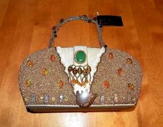 This is a highly sought after design by Sasha Handbags Inc. - New York.  One of their beautiful ornately decorated beaded bags with carven faux coconut accents / center faux jade stone - a wonderful distinctive design by Sasha - the style design number YB476.  This handbag includes a matching beaded strap with an interior woven cord style strap - the interior has a rich crème colored lining - the purse has a fold-over snap closure.  The handbag is NEW with the SASHA handbag tag attached.  The ha Rectangular Beaded Clutch For Travel, Elegant Embellished Shoulder Bag For Travel, Elegant Embellished Travel Bags, Gift Embellished Multicolor Shoulder Bag, Elegant Beaded Shoulder Bag For Travel, Multicolor Bohemian Bags For Formal Occasions, Read My Mind, Beaded Strap, Tag Ideas