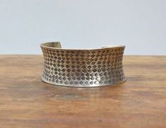 This is a gorgeous Miao/Hmong Silver Cuff Bangle Bracelet from the Miao Hill Tribe people of Southeast Asia. The Miao are an ethnic minority group of people in China.  Miao silver is not pure silver, but an alloy of silver, copper and nickel. It's a traditional material for making jewelry by craftsmen of Miao Hmong ethnic tribe. The percentage of silver is about 60%. Miao/Hmong silver jewelry is distinctive for its design, style and craftsmanship. Miao Hmong silver jewelry is completely handmade with decorative patterns, and the tribal people think silver accessories have spirits. Miao silver often more expensive than 925 silver, mainly because the Miao silver workmanship is very exquisite, and its value is mainly reflected in art. The silver jewelry  is all made by hand. Silver ornaments Mitsuro Hikime, Tribe Jewelry, Miao Silver, Silver Cuff Bangle, Hill Tribe Silver, Silver Ornaments, Cuff Bangle Bracelet, Overland Park, Group Of People