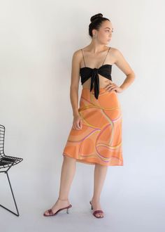 "Vintage 90s abstract silk skirt. Brightly colored abstract silk skirt perfect for the Spring / Summer season! Low-waisted fit. Flowy a-line silhouette. Below knee length. Side hook and eye and zipper fastening. Fully lined. We kindly ask that you please view all measurements for comparison so you can get your desired fit. Made in New York. * Brand: Lafayette New York 148 * Decade: 1990s * Fabric: Silk * Lining: Polyester Crepe * Color: Orange, Lime Green, Pink C O N D I T I O N Excellent vintag Spring Silk Draped Skirt, Spring Asymmetrical Silk Skirt, Summer Asymmetrical Silk Maxi Skirt, Multicolor Flowy Silk Skirt, Summer Flowy Skirt With Abstract Print, Lafayette New York, Pre-draped Asymmetrical Silk Skirt, Spring Abstract, Low Waisted