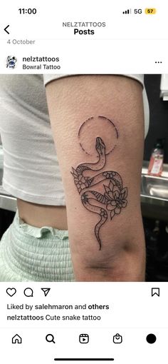 a woman's arm with a tattoo on it and an image of a fish