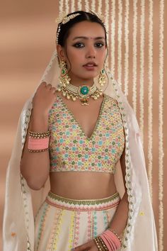 Ivory lehenga with floral embroidered panels. Paired with a blouse with floral grid embroidery and scallop trimmed dupatta. - Aza Fashions Wedding Lehenga With Multicolor Embroidery And Unstitched Blouse, Sleeveless Multicolor Embroidered Wedding Set, Sleeveless Wedding Lehenga With Floral Embroidery, Multicolor Embroidered Fabric For Unstitched Blouse For Wedding, Multicolor Embroidered Fabric For Wedding Blouse, Multicolor Embroidered Fabric For Wedding, Multicolor Sleeveless Wedding Set, Grid Embroidery, Chanderi Lehenga