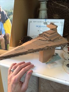 a person is making a model of a ship