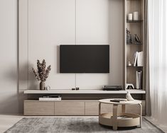 a living room with a large television on the wall