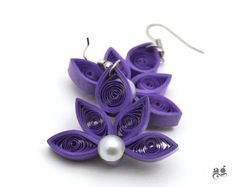 the earrings are made out of purple paper and have pearls on each earwires