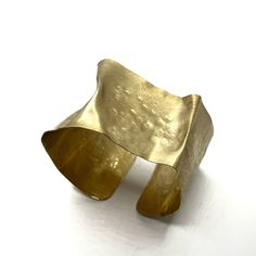 Brass Bracelet - This flexible cuff is crafted from brass thats been folded, hammered, sanded, and brushed with care. The result is a wearable work of art with a soft, glowing matte finish. Its flexibility allows it to be worn in a variety of ways, on a variety of wrists sizes. Brass Cuff Bracelet, Wide Cuff Bracelets, Brass Cuff, Brass Bracelet, Artful Home, Gold Bracelet Cuff, Metal Shop, Bracelet Cuff, Wide Cuff