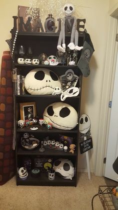 a book shelf filled with lots of halloween items