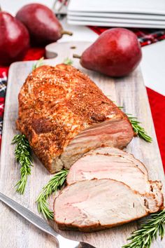 sliced pork on cutting board with apples and knife