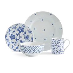 a blue and white dinnerware set on a white background