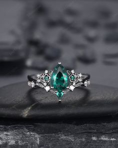 Rhodium black engagement ring like no other. This AMAZING piece of fine jewelry is the perfect expression of your eternal love. Its BLACK colors bring out the beauty of this ring. Black gold finish pear cut emerald engagement ring set, rhodium black teardrop emerald bridal set, gothic anniversary ring, witchy black plating emerald promise ring gift for women, mom, best friend, girlfriend and wife. ★Description Main ring: *Center stone: 6x8mm Pear Cut Lab Created Emerald * Material: silver/10K/14 Gothic Emerald Engagement Ring, Emerald Princess Cut Ring, Emerald Wedding Ring Silver, Slytherin Engagement Ring, Black And Green Wedding Ring, Black Emerald Ring, Emerald Rings Silver, Black And Green Ring, Emerald Engagement Rings Silver