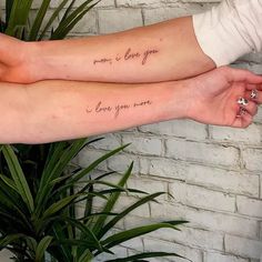 two people holding each other's arms with tattoos on their arm saying, mom is love you more