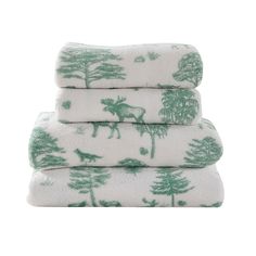 three green and white towels stacked on top of each other