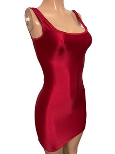 a mannequin wearing a red dress with one shoulder cut out and an open back