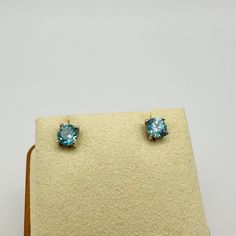 Sterling Silver Round Cut Blue Zircon Stud Earrings 4.5 mm Classic round cut blue zircon studs, beautifully faceted, medium saturated swimming pool color stones, reflect the light amazingly well Diameter measurement: 4.5 mm, around 0.5 carats each 1 carat total Four-prong set in sterling silver Regular pushbacks In excellent condition, will include a pouch and jewelry box Classic Round Blue Topaz Earrings, Classic Blue Diamond-cut Earrings, Classic Blue Diamond Cut Earrings, Blue Topaz Earrings With Brilliant Cut As A Gift, Blue Diamond Cut Round Earrings, Sapphire Blue Topaz Round Earrings, Blue Round Topaz Earrings, Blue Topaz Blue Earrings, Blue Topaz Round Earrings