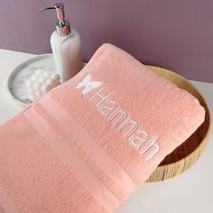 a pink towel sitting on top of a bathroom counter