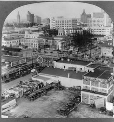 an old black and white photo of a city