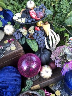 a table topped with lots of different types of fruit and veggies next to each other