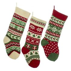 three christmas stockings hanging on a clothes line