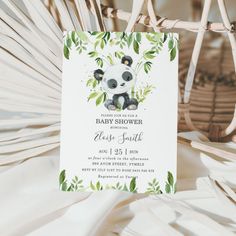 a panda bear is sitting on top of a palm leafy chair and it's baby shower card