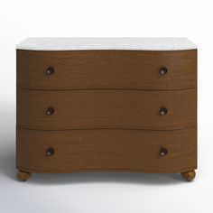 a brown and white chest of drawers with two marble top pulls on the bottom drawer