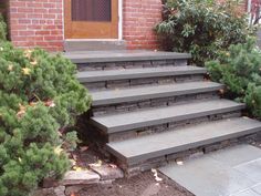 a set of steps leading up to a brick building