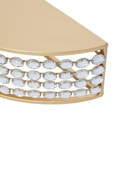 an image of a table that is made out of gold and white glass beads on it