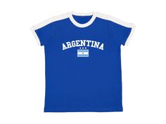 Argentina Baby Tee Blue ringer t shirt with white contrast collar, arched Argentina graphic, Argentinian flag and stars. Blokette and soccer inspired jersey shirt. #sporty #coquette #blokecore #handmade #summer Available in sizes small, medium, and large Measurements (in inches): Small- Width: 16 Length: 21.5 Medium- Width: 18 Length: 23 Large- Width: 19 Length: 25 Care Instructions: * Do not dry clean * Wash and dry inside out * Hang dry (preferred) or machine dry on a delicate setting * Use cold water * Use mild detergent * Do not bleach Sporty Coquette, Argentinian Flag, Bebe T Shirt, Argentina Flag, Boxy Crop Top, Baby T Shirts, Contrast Collar, Vacation Shirts, Jersey Shirt