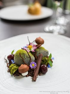 a white plate topped with food on top of a table