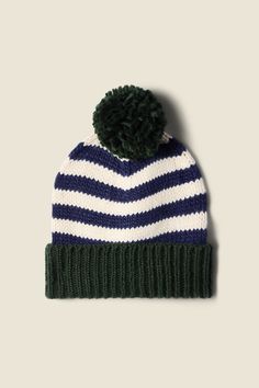 WHY YOU’LL LOVE IT Designed with a lived in feel, so it is not too precious Classic details that will last generations Easy to dress-up or dress-down Made from our Super Soft Acrylic YOUR WHIMSICAL GO-TO Our beanies are a nostalgic nod to the winter beanies of our childhood, knit in a super soft acrylic yarn. Featuring classic stripe patterns with a contrasting pom-pom and cuff-able ribbed hem. Shown here in Blue Stripe and made from our super soft acrylic. The Beanie is one size only, and measu Winter Beanies, Winter Beanie, Holiday Catalog, Acrylic Yarn, Stripes Pattern, Long Tops, The Winter, Blue Stripes, Fiber Art