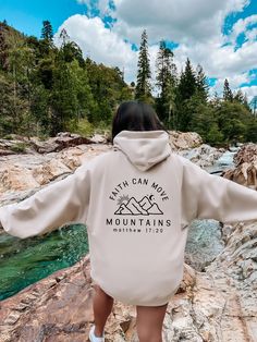 Faith Can Move Mountains Hoodie, Faith Hoodie, Christian Hoodie, Bible Verse Hoodie, Religious Hoodie, Gift for Christian, Christian Women Hoodie 💖Youth Hoodies do not have drawcord for added safety!💖 Material: 50% cotton, 50% polyester for a comfortable and durable blend. Fabric: Medium-heavy (8.0 oz/yd² or 271.25 g/m²) for warmth on cooler days. Fit: Loose fit for comfort without sacrificing style. Label: Sewn-in for a seamless feel. Sizing: Check our sizing chart for the right fit. HOW TO P Letter Print Hoodie Sweatshirt For Outdoor Activities, Fleece Hoodie With Letter Print For Outdoor Activities, Outdoor Letter Print Hoodie Sweatshirt, Letter Print Hoodie For Outdoor Activities, Hooded Hoodie With Drawstring For Hiking, Outdoor Hooded Sweatshirt With Letter Print, Hooded Hoodie With Letter Print For Outdoor, Outdoor Hoodie With Adjustable Hood, Hooded Hiking Hoodie With Drawstring