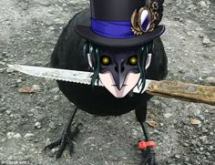 a black bird with a top hat and knife in its beak