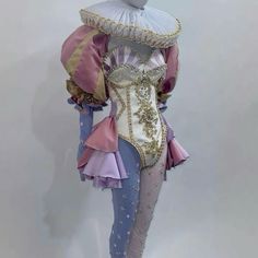 a mannequin dressed in an elaborately designed outfit