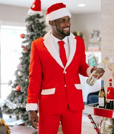 If only we could hold office meetings and contain our love for Christmas in a composed manner. Buh-bye Casual Friday, hello Santa Christmas suit! This Men's Red Santa Christmas Blazer merges the iconic look of Saint Nick with everyday office wear - it even comes with its own candy cane-inspired tie. Big sales proposal? No problem! Post-Christmas party disciplinary? Piece a cake. You might even be tempted to turn up the humor at a funeral is the mood strikes you - who could frown at this fetching Christmas Wedding Suits Groom Attire, Christmas Wedding Suits, Mens Christmas Suit, Red Christmas Outfit, Christmas Blazer, Christmas Outfit Men, Hello Santa, Christmas Suit, St Nick