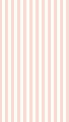 a white and pink striped wallpaper with vertical stripes