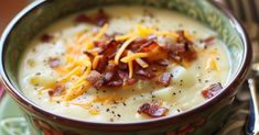 a bowl of potato soup with bacon and cheese