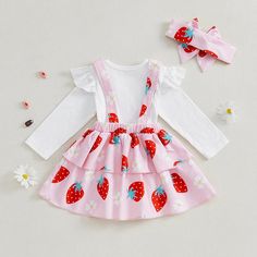 Includes: Onesie, Dress, & BowMaterial: Cotton, Polyester BlendGender: GirlsPattern: Strawberries, FloralSleeve Length: LongSummary: Baby Toddler Long Sleeve Solid White Ruffled Onesie with Ruffled Strawberry Print Overalls Dress & Bow 3 Piece Outfit